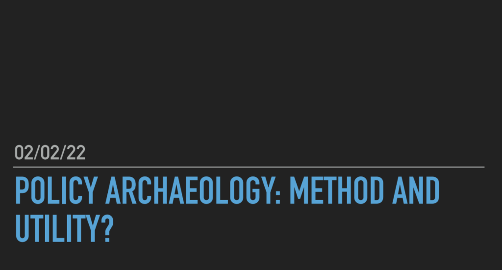A cover slide with black background and text that says POlicy Archaeology: Method and Utility? 